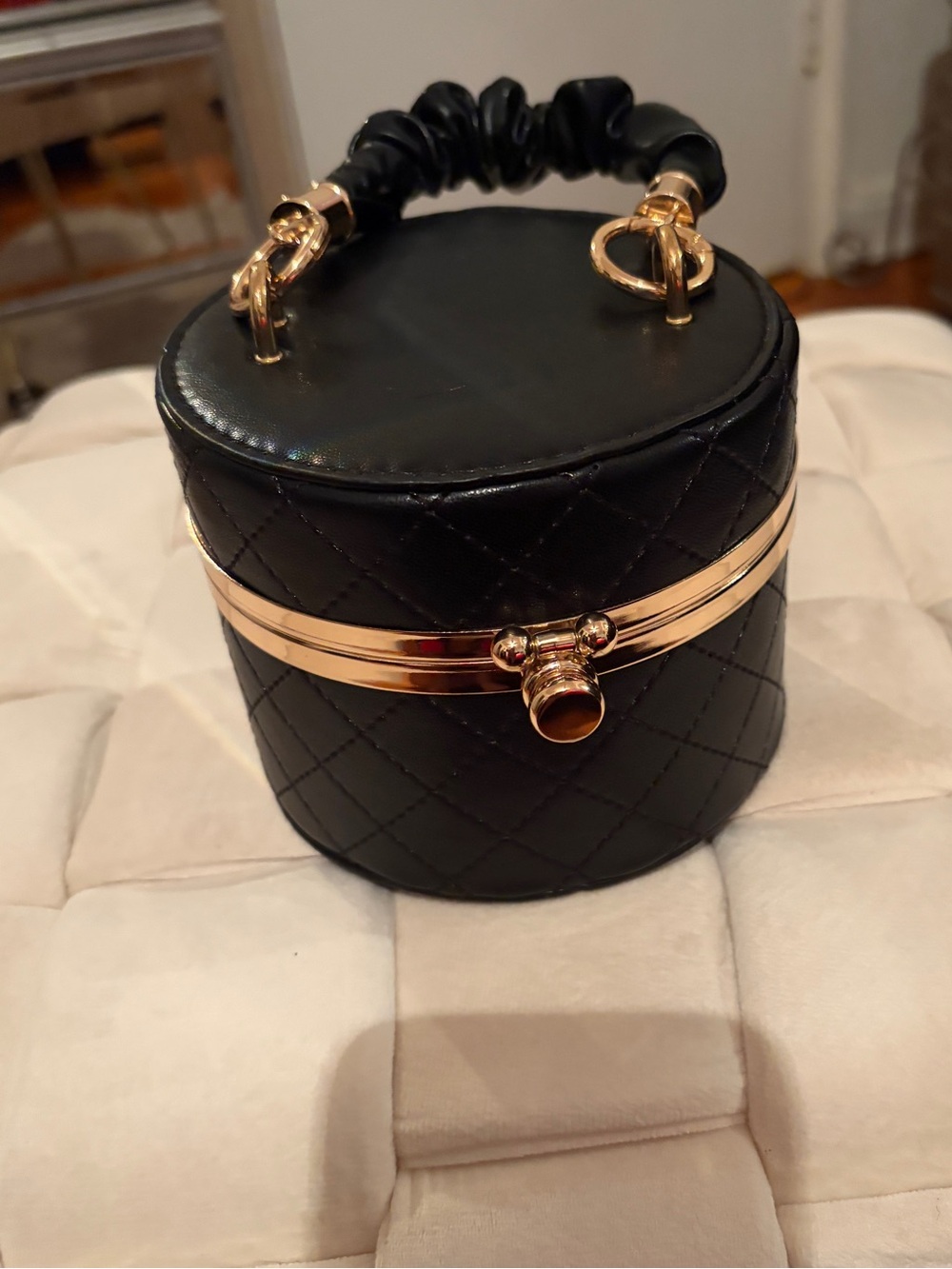 Black Quilted Barrel Handbag with Gold Trim